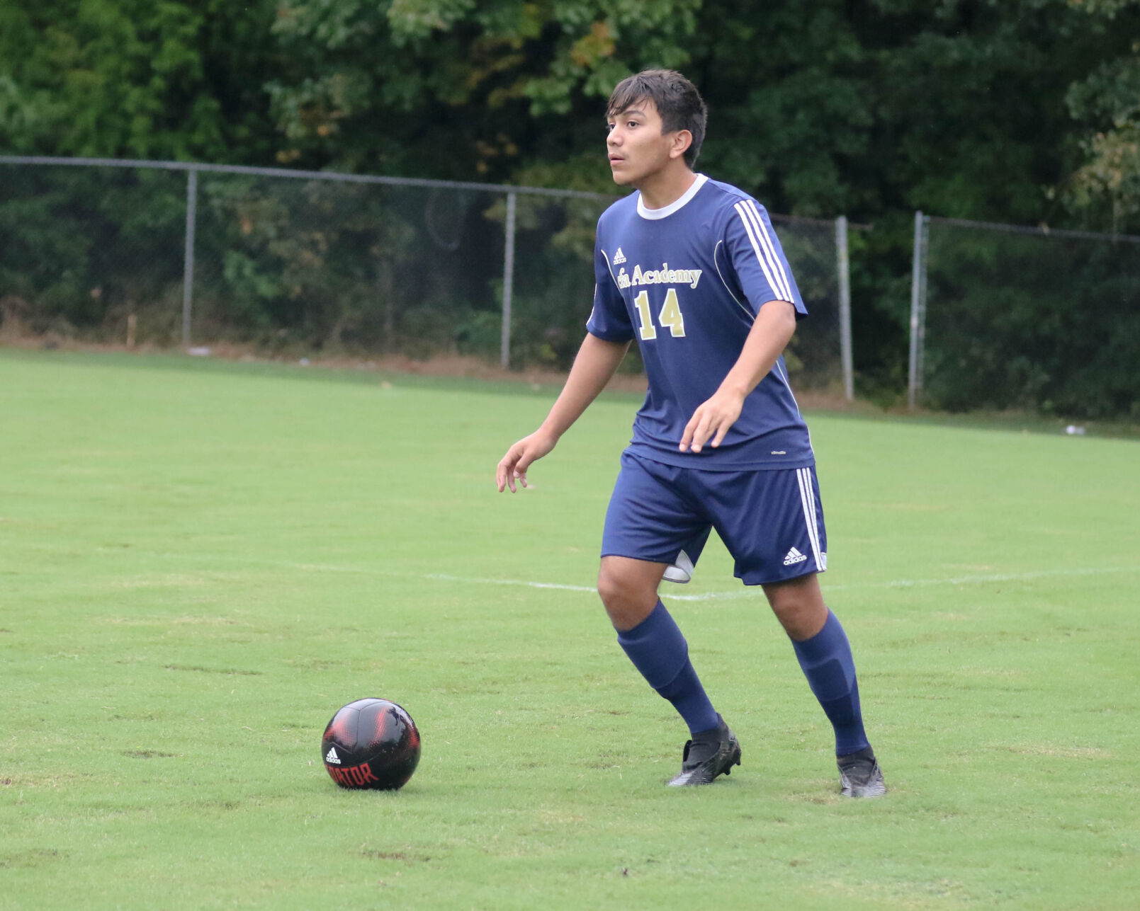 Concord Academy vs Hickory Grove .Concord Academy's Jose Cisneros looks upfield to pass. Joan Moore/Special to the Independent Tribune